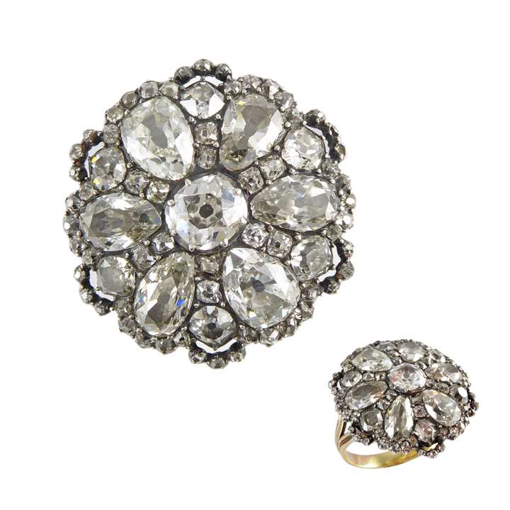 Late 18th century diamond flowerhead cluster ring c.1790, probably originally a button, the circular panel slightly domed and set with six pear cut diamond petals,